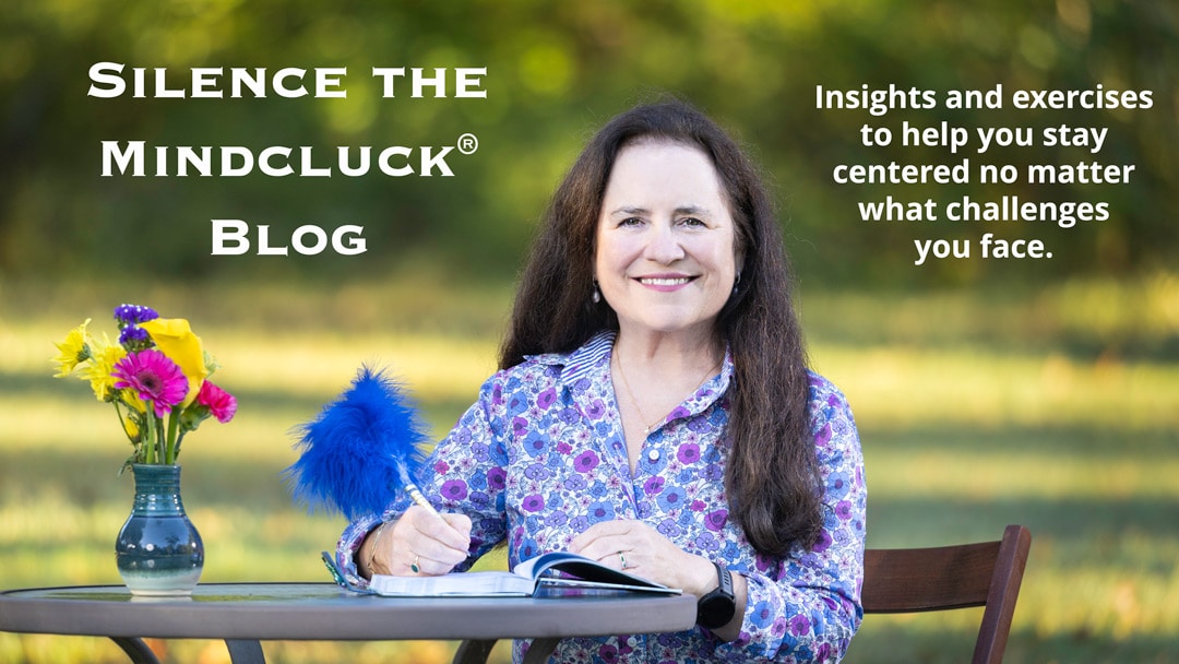 Intuitive Strategy Guide, Maria T. Finch sitting at a table outside handwriting a blog post.